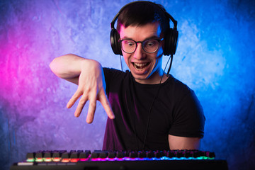 Portrait of funny nerd working on computer