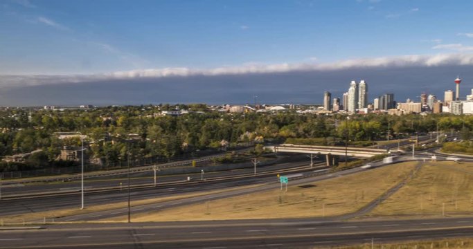 Turning time lapse of highway and Calgary skyline from Tom Campbell's Hill Natural Park, Bridgeland, Calgary, Alberta, Canada, North America