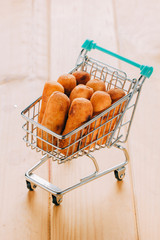 Venezuelan snack called teque&ntilde;os inside a mini shopping cart