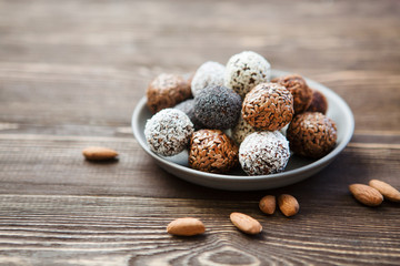 the vegan of handmade candy on a wooden background. Fitness sweets. candies without sugar.