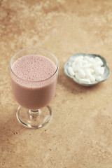 Glass of protein shake and BCAA amino acids. Nutrition for bodybuilding. Copy space.