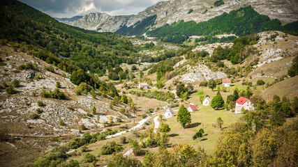 Fototapeta na wymiar Beautiful small mountain village in the valley