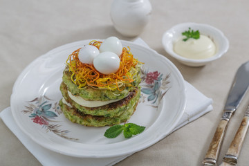 Healthy breakfast with zucchini fritters and eggs