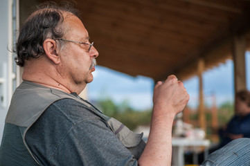 Man smoking a cigarette outside