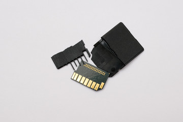 Broken memory cards on a white background.