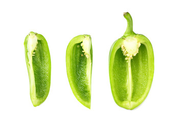 cut slices of green sweet bell pepper isolated on white background top view