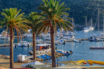 Yachts and boats in the harbor at sunset, reflection, beautiful coastal view, French Riviera. Holidays in France.
