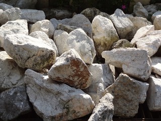 Closeup group pile of big rough rock for decorate in the garden texture background