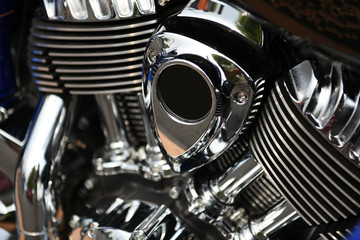 Motorcycle engine assembly, shiny chrome, closeup, angled