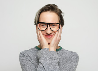 young attractive man wearing glasses, smile and happy