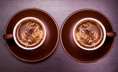A cup of delicious coffee on a dark background