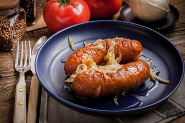 Fried sausage with onions.