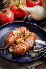 Fried sausage with onions.