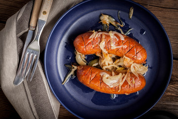 Fried sausage with onions.
