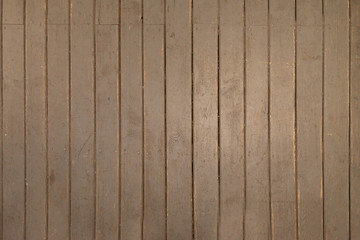 Old wooden painted floor. The floor is painted gray and in some places it is erased. Wood floor texture