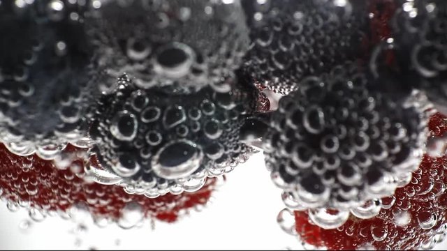 fresh fruits in the water with drops of water