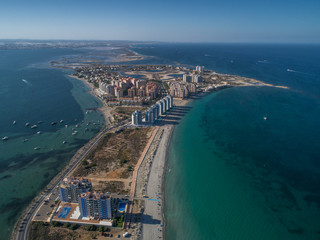 Aerial photo of tall buildings and the beach on a natural spit of La Manga between the Mediterranean and the Mar Menor, Cartagena, Costa Blanca, Spain 15