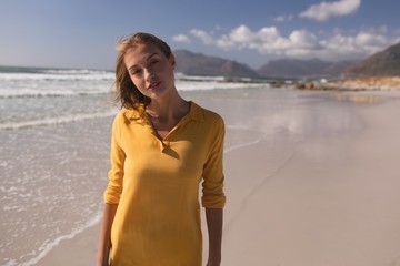 Young woman standing on the beach