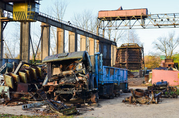 Fototapeta premium Truck after accident crashed into pieces. Disposal of the car. Disassembled cars after an accident, sale of auto parts and cars