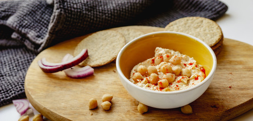 Oatcakes and hummus photographed from above.