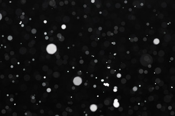 Snow bokeh texture on black background