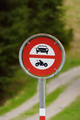 Road sign prohibiting access to cars and motorbikes on walk trail