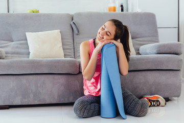 Young woman before or after practicing yoga