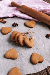 Fototapeta na wymiar Baked cookies-hearts on the vintage wooden table. Valentine's Day