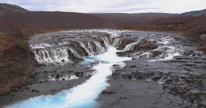 Bruarfoss (Bridge Fall), is a waterfall on the river Bruara, in southern Iceland where a series of small runlets of water runs into a beautiful, turquoise-blue colored pool.