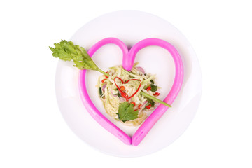 Pink sausage cheese in heart style with spicy green mango salad.