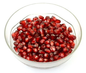 pomegranate seeds in a bowl isolated on white background. pomegranate berries.