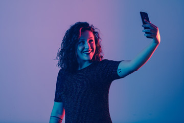 young girl making selfie and smiling