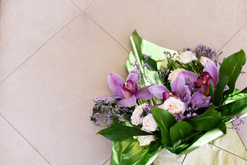 bouquet with orchids and roses on a beautiful background