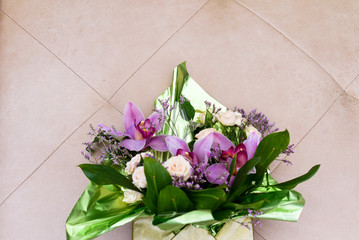 bouquet with orchids and roses on a beautiful background