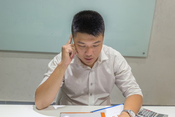Asian businessman talking on the mobile phone