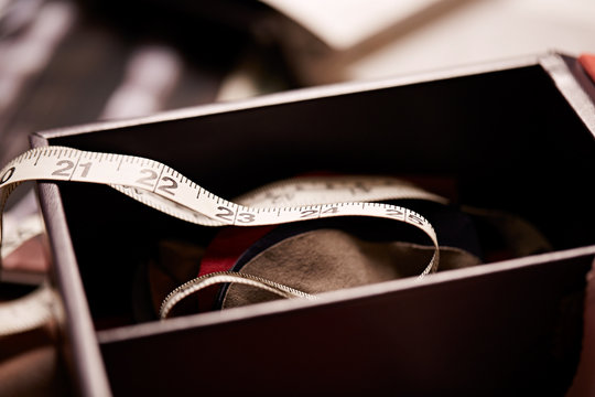 fabric measuring tape in box on worktable