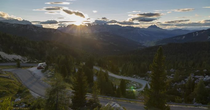 time lapse of sunset over countryside and mountains at Passo Valparola, Dolomites, South Tyrol, Italy, Europe