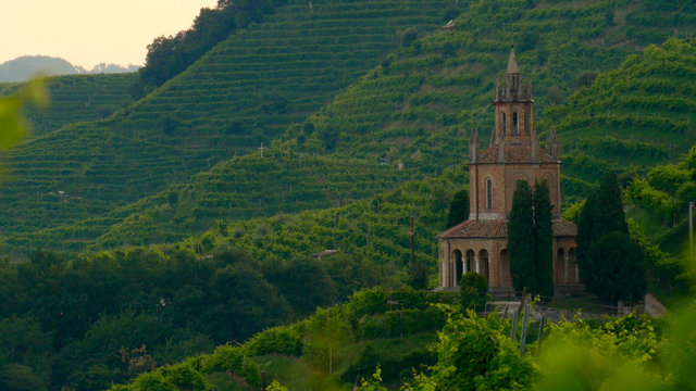 View of the green Prosecco wine hill - Saint Martin Temple - Tempio di S. Martino - Conegliano Valdobbiadene - Strada del Prosecco