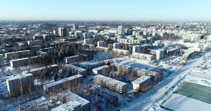 Espoo Finland, Flying up over an area of concrete panel buildings on a winter day