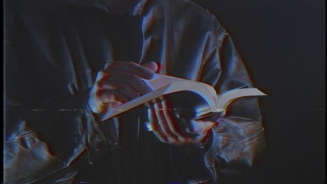 Man reading the holly bible. Vintage footage 80s 90s VHS look