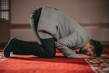 Muslim man praying in mosque