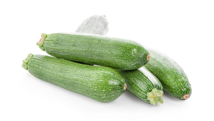 green fresh zucchini isolated on white background