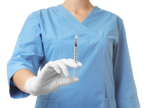 Female doctor with syringe on white background, closeup. Medical object