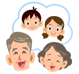 孫のことを思い浮かべて笑顔の老夫婦
