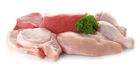 Various raw meats with parsley on white background