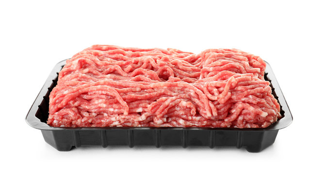 Plastic container with minced meat on white background