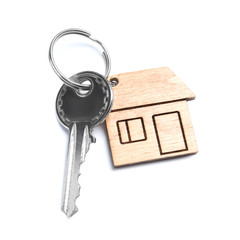 House key with trinket on white background