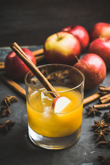 Old fashioned apple beverage on the rustic background. Selective focus.