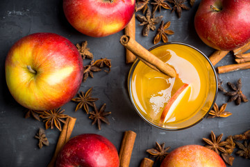 Old fashioned apple beverage on the rustic background. Selective focus.