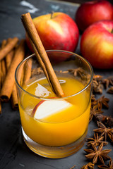 Old fashioned apple beverage on the rustic background. Selective focus.